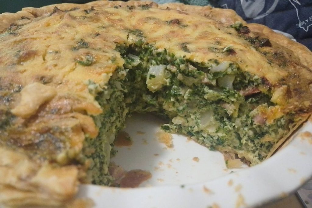 Turtle Pizza (aka Bacon spinach quiche) in a white deep pie dish